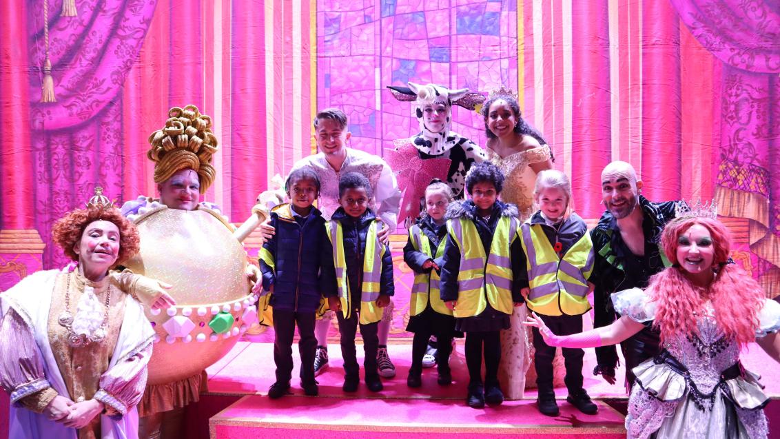 Children from Moldgreen Community Primary School with the cast of Jack and the Beanstalk at Lawrence Batley Theatre