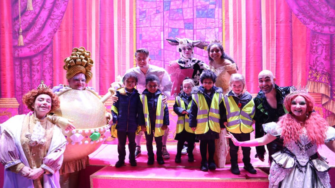 Children from Moldgreen Community Primary School with the cast of Jack and the Beanstalk at Lawrence Batley Theatre